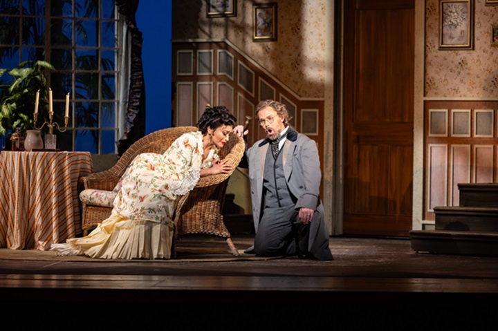 Cecilia Violetta López as Violetta responds to Troy Cook as Georgio Germont's urging in Florida Grand Opera's production of “La Traviata.”