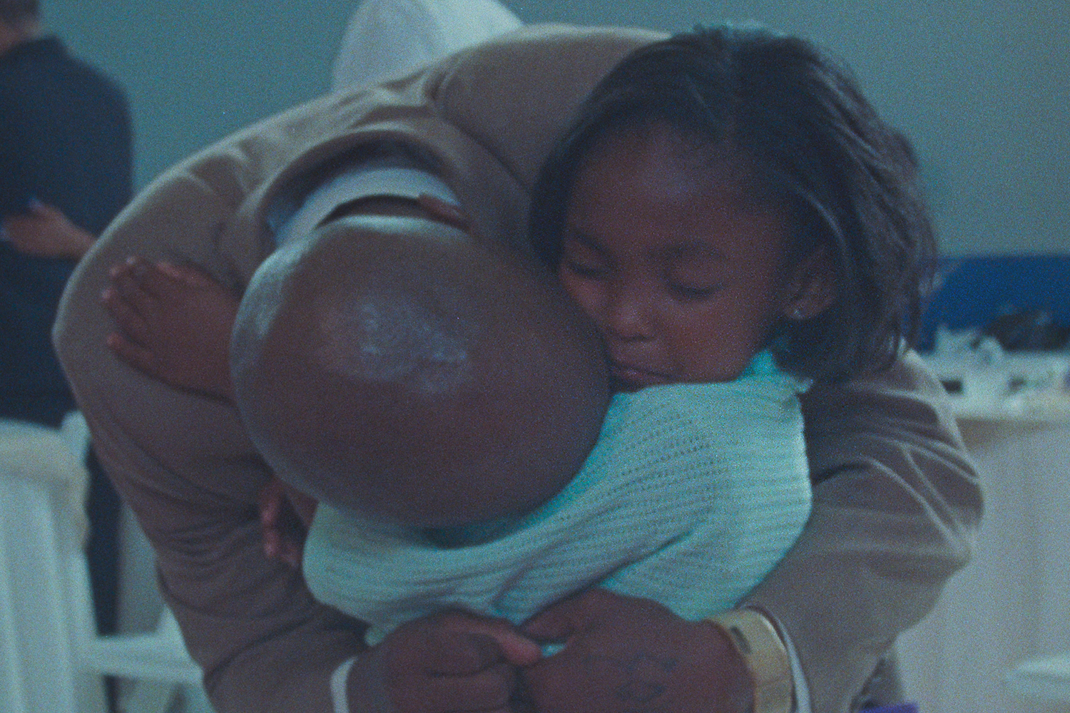 Aubrey and her father Keith share an embrace in the documentary 