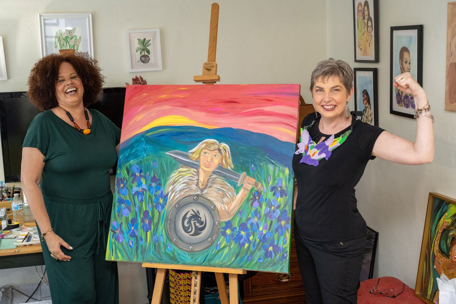 Artist Rosa Henriquez and inspiration Morgen Chesnois-Gonzalez pose with the art piece inspired by Morgen's experience, as part of the Arsht Center's Brushes with Cancer program (Photo by Gregory Reed)