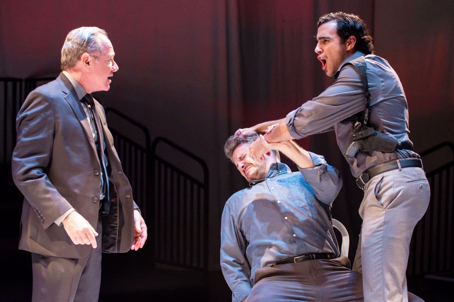 Policemen Tupolski (Michael McKeever) and Ariel (Gabriell Salgado) don't always agree on how to handle matters as Ariel punches Katurian (Ryan Didato). (Photo by Justin Namon)