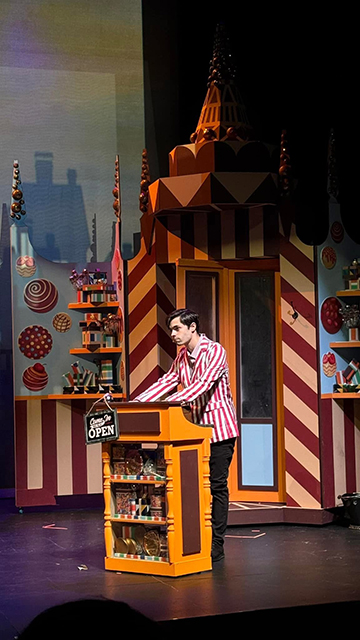 In addition to portraying Willy Wonka, Benjamin Leon IV appears as a mysterious candy store operator.