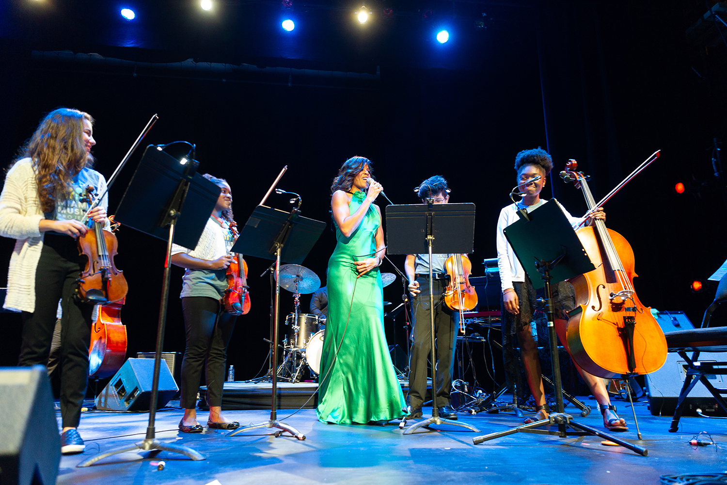 Nicole Henry with student musicians from the Miami Music Project. Proceeds from her Winter Concert goes to the Miami Music Project. (Photo by Sergio at Eyeworks)