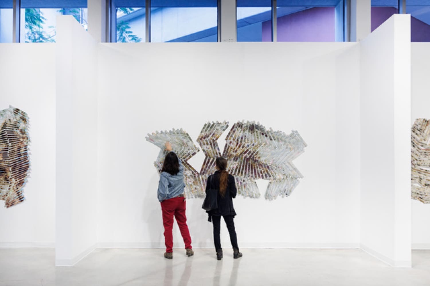 Regina Jestrow explains her work to Irene Sperber (Photo by Frank Casale/courtesy of MDC Gallery)