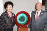 Sheldon and Myrna Palley pose next to their own Planet of the Wasps, on loan to Jewish Museum of Florida