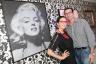 Florencia Jimenez-Marcos and Xavier Gonzalez-Sanfeliu next to Russell Young's Marilyn Portrait.