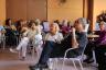 Audience members attend a pre-show talk discusses the play.